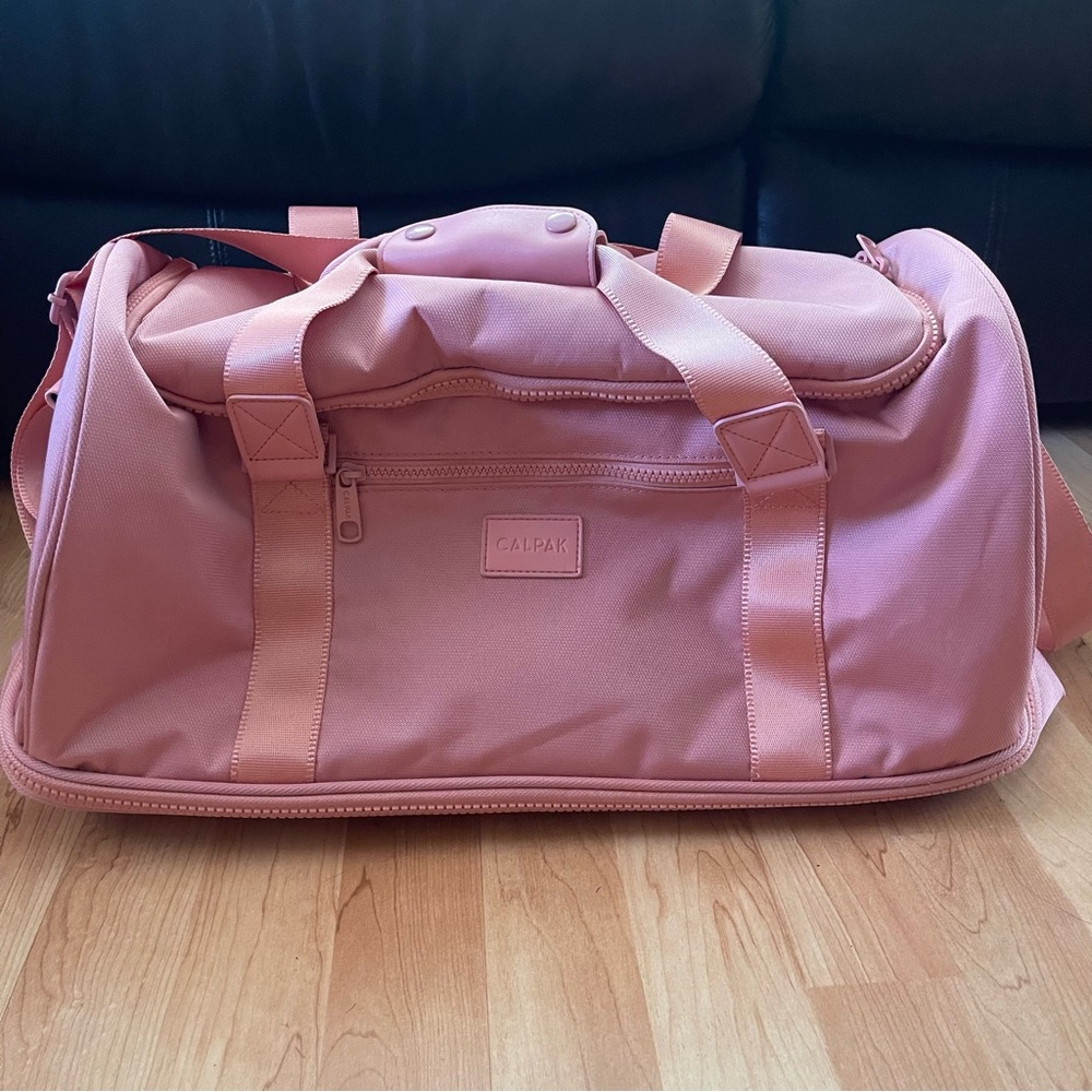 Calpak Stevyn duffel bag with shoe compartment in pink sand